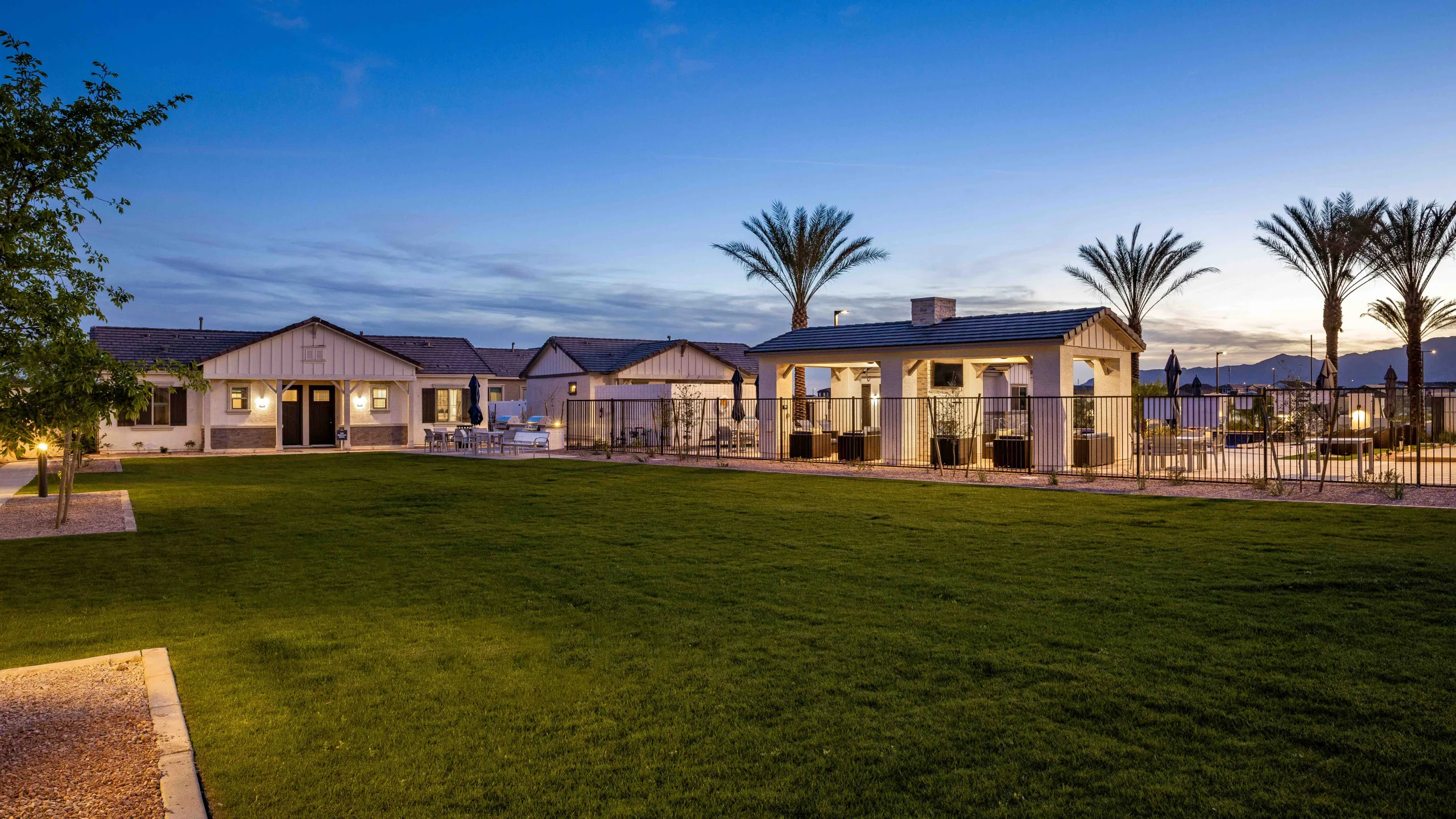 Twilight view of new homes from courtyard in Surprise, AZ