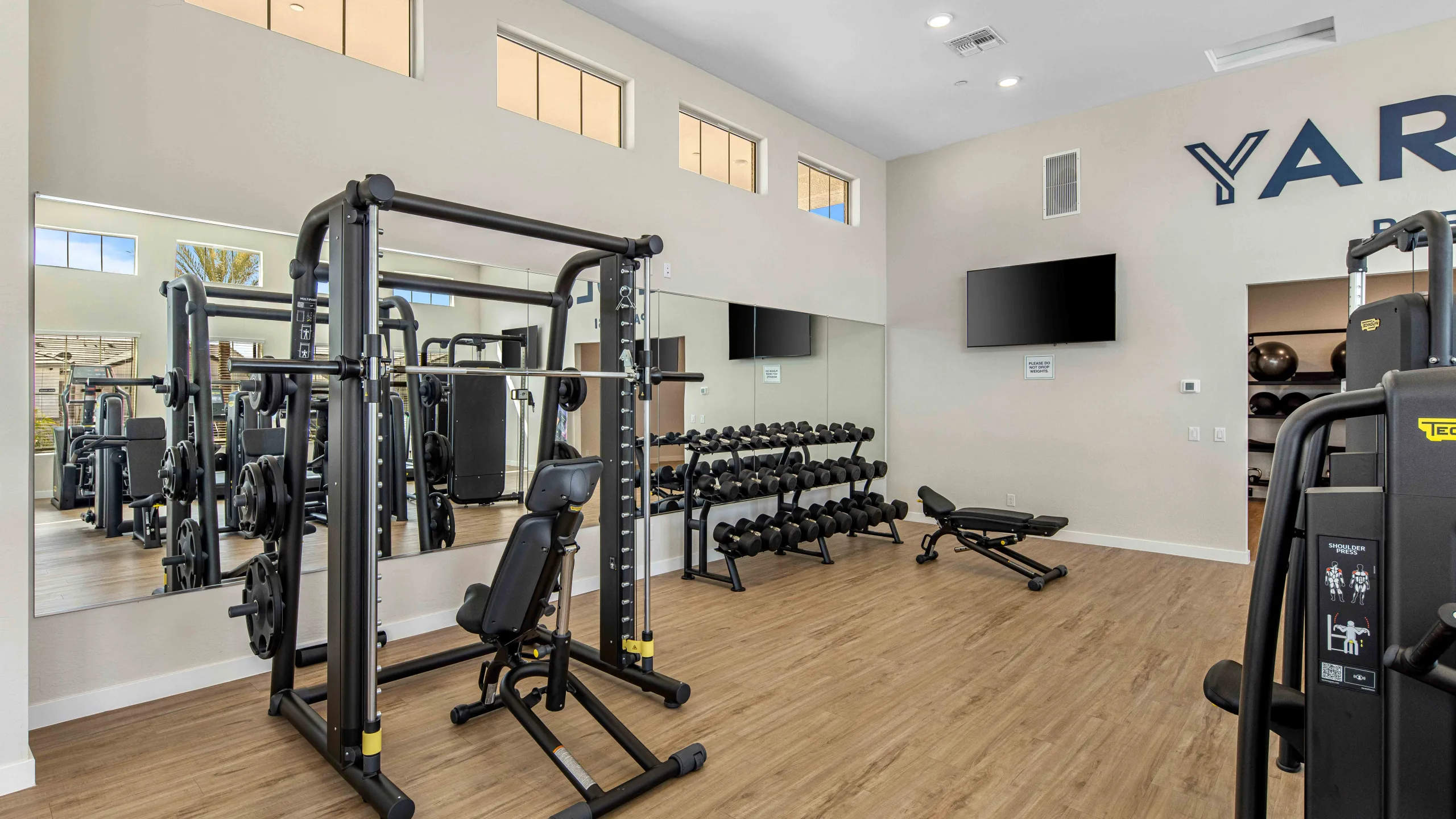 Onsite gym at Yardly Paradisi, new homes that are pet- friendly for rent with backyards near Phoenix AZ.